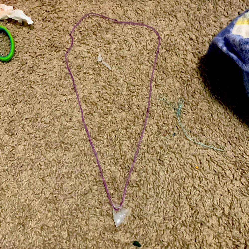 Comes with a triangle charm and we made it ourselves
